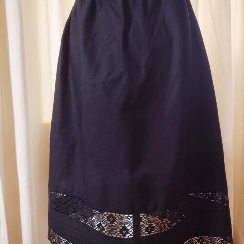 black cotton petticoat embellished with lace trims and pintucks