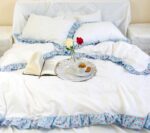 white cotton duvet cover adorned with floral double-faced ruffles