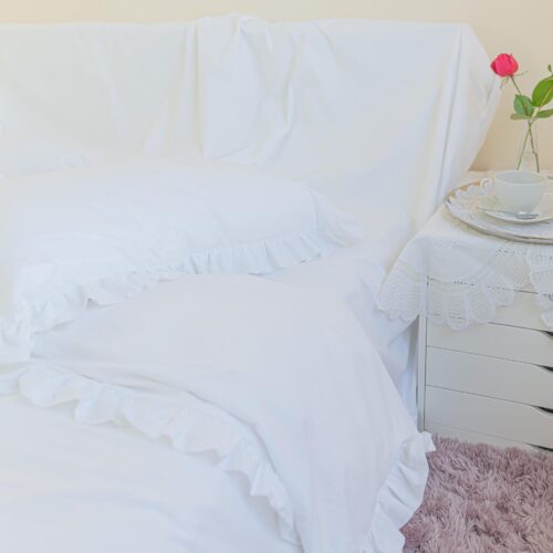 white polycotton duvet cover adorned with double-faced ruffles all around it