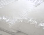 white cotton pillowcases adorned with frills and lace trims