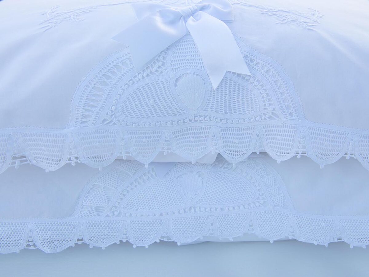 white cotton pillowcases embellished with handmade lace trims and hand embroidery