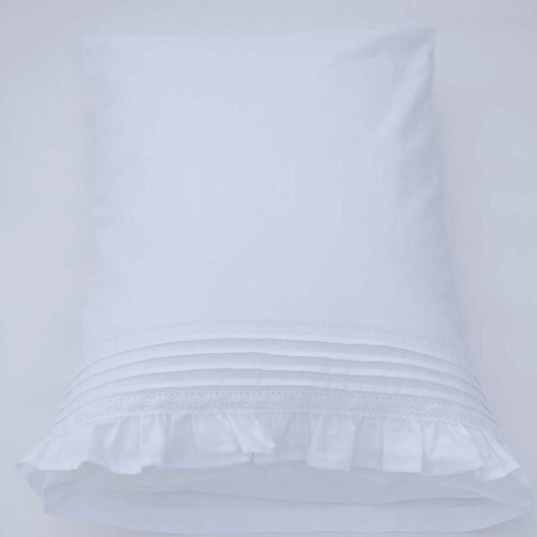 white cotton pillowcases adorned with pleats, frills and a lace trim
