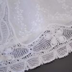 baby christening gown lavishly embellished with hand made lace trims and hand embroidered