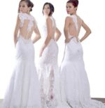 Three models wearing handmade lace wedding dresses