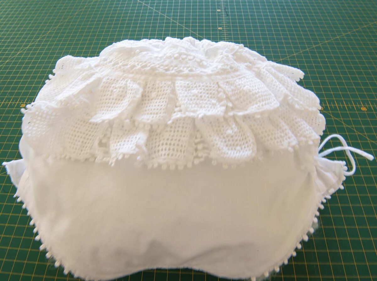 bespoke white cotton girls and women frilly knickers bloomers adorned with lace trims, several pin tucks on the front and side bows