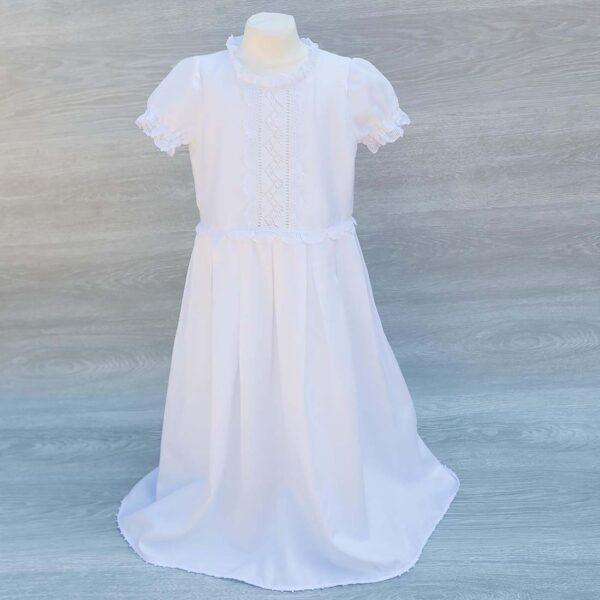 pristine white cotton girl holy communion dress embellished with gorgeous handmade lace trims